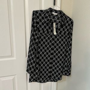 Elegant blouse . New.  Elegante. Negra y exprimido blanco